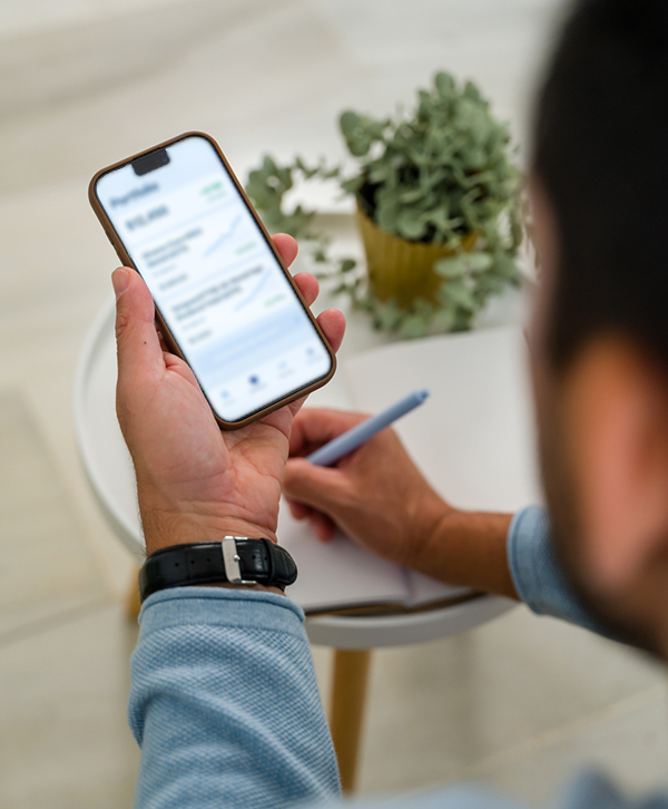 man looking at portfolio on mobile phone